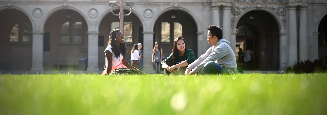 students sitting on campus