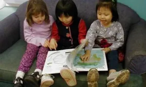 children reading a book