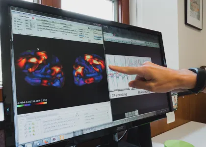 computer screens showing graphs