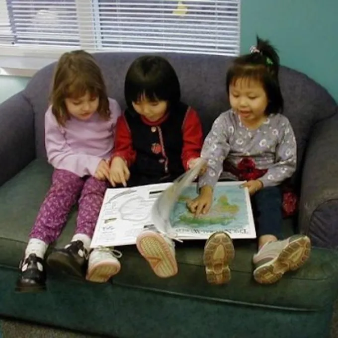 children reading a book