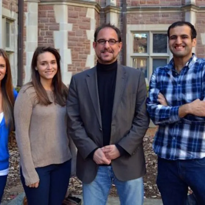 professor and students and a lab group